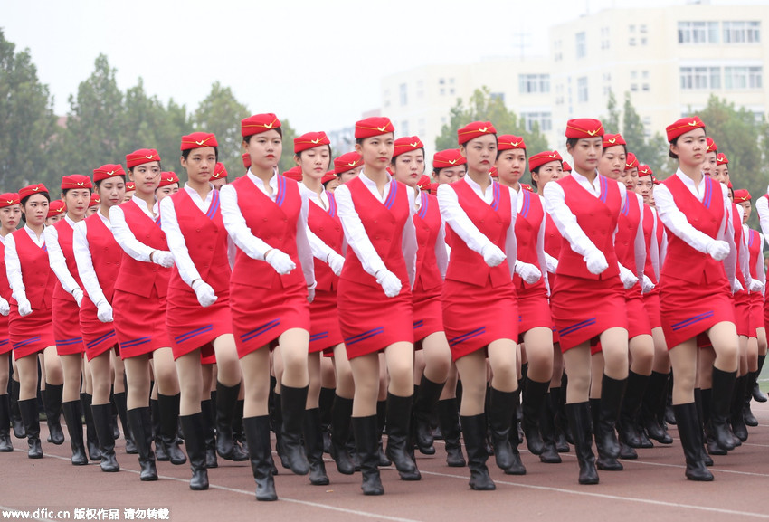 Gorgeous stewardesses-to-be attend military training