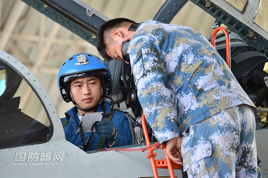 Chinese J-11 fighters conduct training in South China Sea