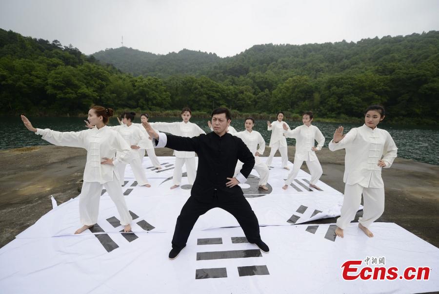 Tai Chi master leads lake performance 