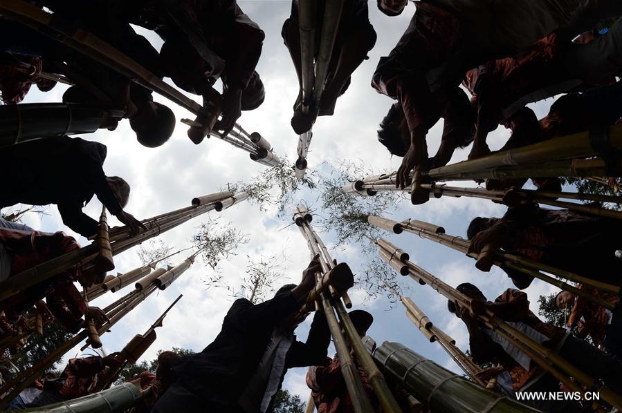 The festival, during which local people make sticky rice cakes, is held on Monday to celebrate the harvest and to pray for a good farming season.