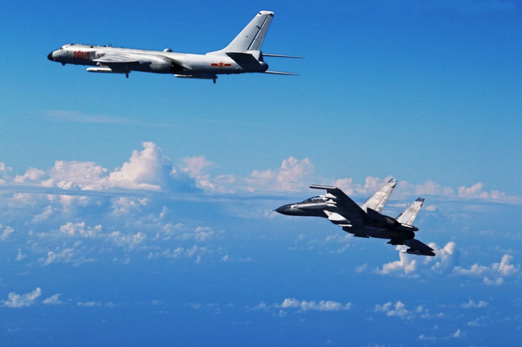 H-6K, Su-30 participate in military exercises