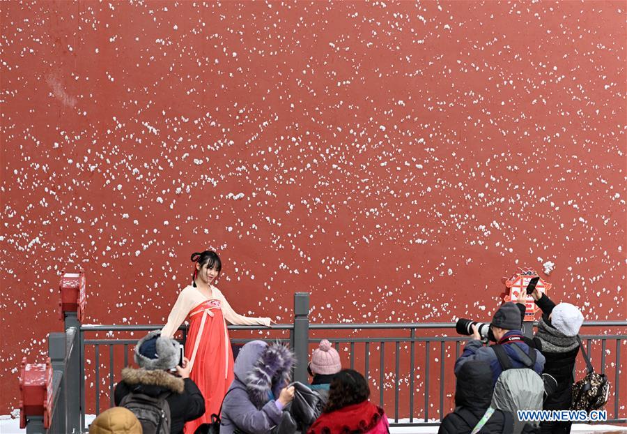 Visitors view snowy scenery at Palace Museum in Beijing