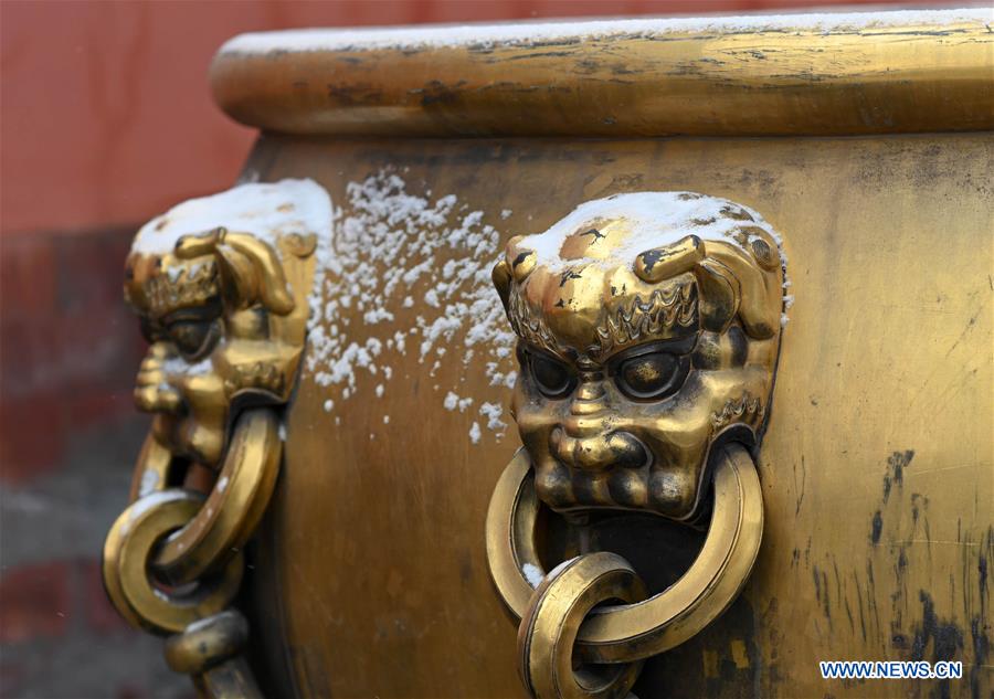 Visitors view snowy scenery at Palace Museum in Beijing