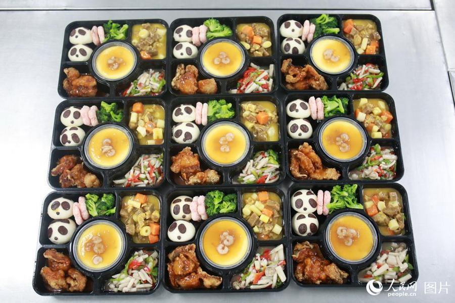 How are the boxed meals on China’s high-speed trains produced?