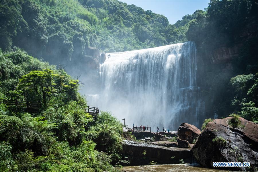 Tourists visit Chishui Waterfall in Guizhou, SW China