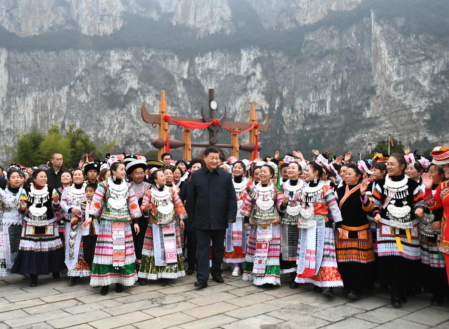 Chinese President Xi Jinping, also general secretary of the Communist Party of China Central Committee and chairman of the Central Military Commission, talks to villagers who are participating in festive activities, and extends his New Year’s greetings to people of all ethnic groups across the country, on a public square of Huawu Village, Xinren Miao Township of Qianxi County, Bijie, southwest China’s Guizhou Province, Feb. 3, 2021. Xi on Wednesday inspected southwest China’s Guizhou Province ahead of the Spring Festival, or the Chinese Lunar New Year. (Xinhua/Xie Huanchi)