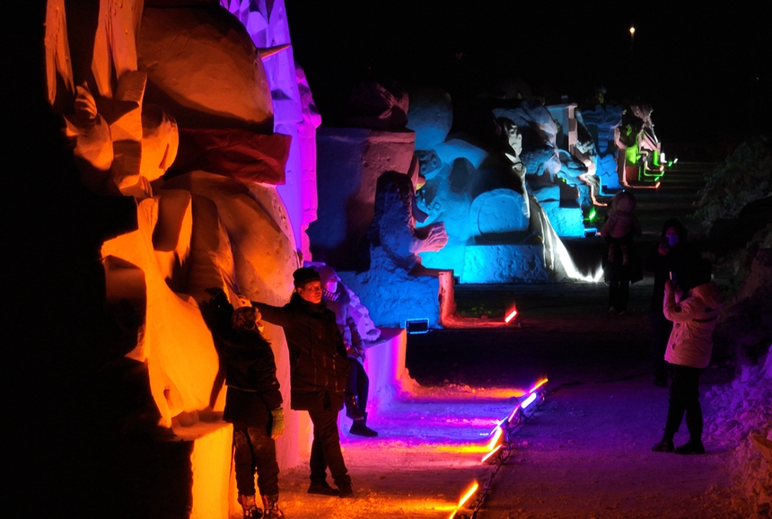 Colorfully lit snow sculptures, busy fish market add festive atmosphere in China's easternmost city