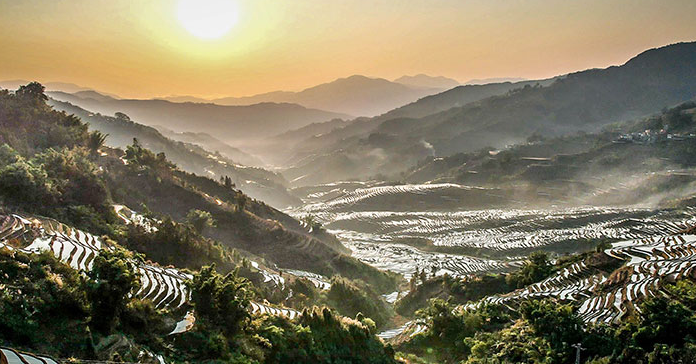 Spring farming gets going on SW China's Yunnan rice terraces