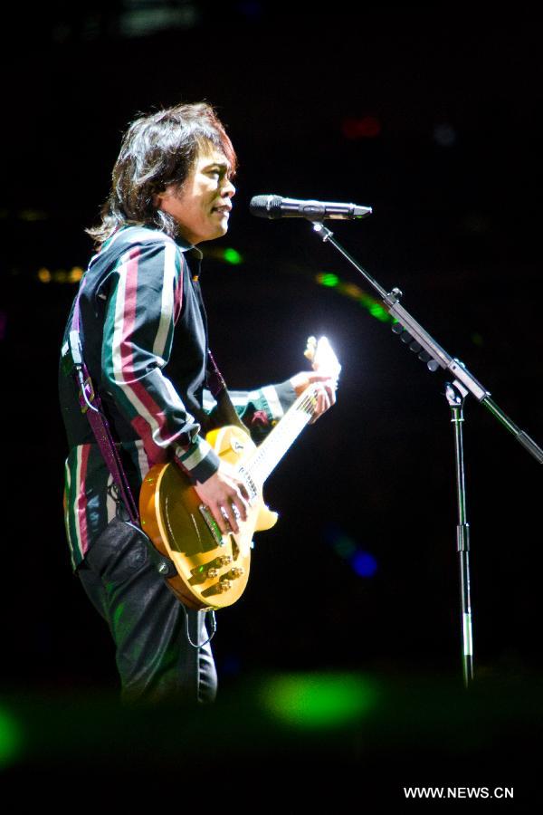 Singer Wu Bai sings at Rock Records 30th Anniversary Nanjing Concert in Nanjing, capital of east China's Jiangsu Province, Nov. 10, 2012. More than 50 singers performed at the concert. (Xinhua/Hei Songzi)  