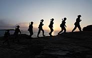 Officers and men patrolling along the coastline