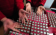 Staff members of bus company sort notes, coins 