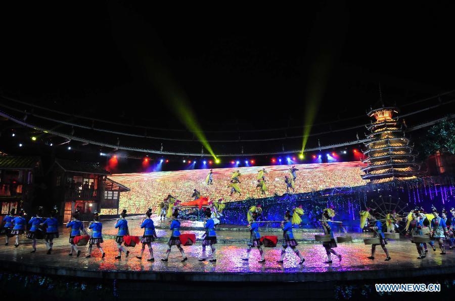 Dance drama "Zuo Ye", a traditional love and social activity of the Dong ethnic group, is performed during a festival in Sanjiang Dong Autonomous County of Liuzhou City, southwest China's Guangxi Zhuang Autonomous Region, Nov. 30, 2012. (Xinhua/Lai Liusheng) 