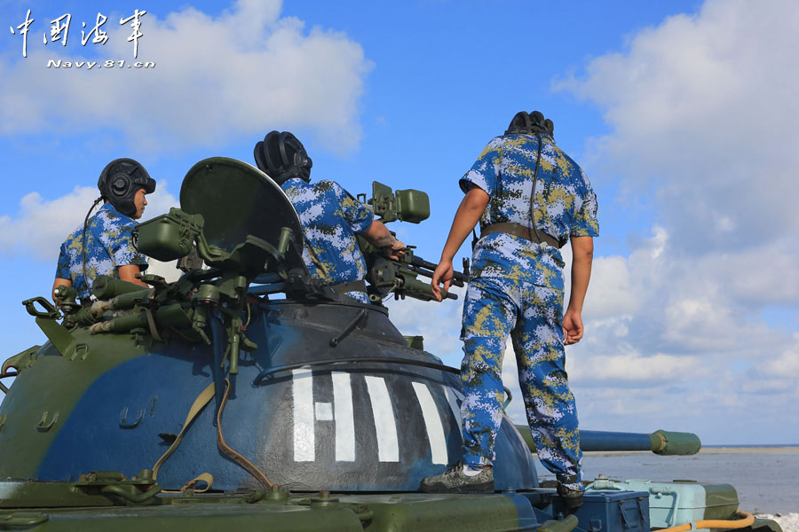 A tank company under a maritime garrison command of the Chinese People's Liberation Army (PLA) stationed on the Sansha Island conducts a live-ammunition shooting training with tank-mounted anti-aircraft machine gun, in a bid to temper troops' combat capability. (navy.81.cn/Chen Xianling, Liu Weiping)