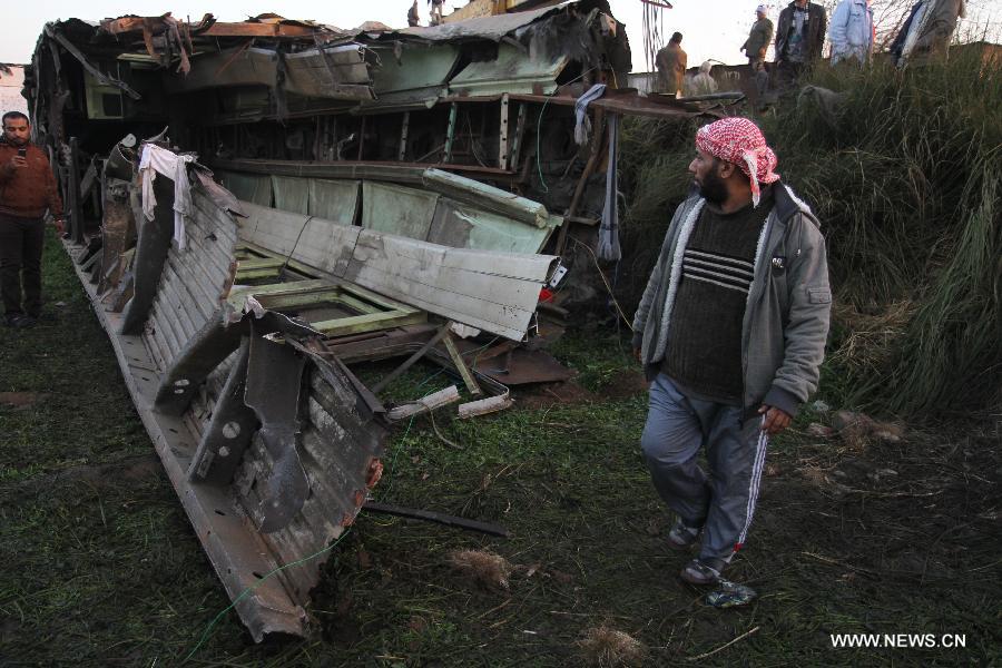 The derailed train is removed from accident site at the Giza neighborhoods of Badrashin, Egypt. A military train derailed in Egypt early Tuesday, killing at least 19 conscripts and injuring 107 others, a spokesman from the Health Ministry said in a statement to official MENA news agency. (Xinhua)