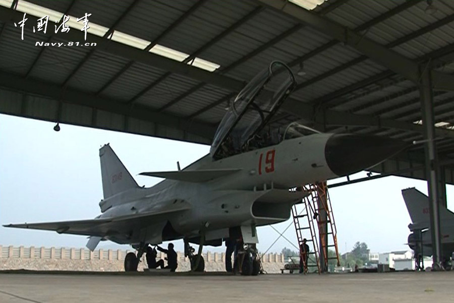 A flight delegation of China's naval air force conducts a long-range raid exercise, and they shoot down the simulated "enemy aircraft" during the exercise. The exercise marked a new breakthrough in their precision raid and actual combat capability. (navy.81.cn/Li Ronglei, Wang Zhenbing)