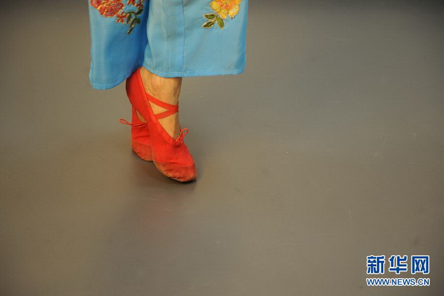 Yao Yao, 60, rehearses dancing before the show on Jan. 15, 2013. 