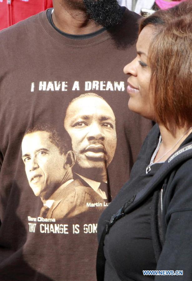 People take part in the Martin Luther King Parade in Houston, the United States, on Jan. 21, 2013. (Xinhua/Song Qiong) 