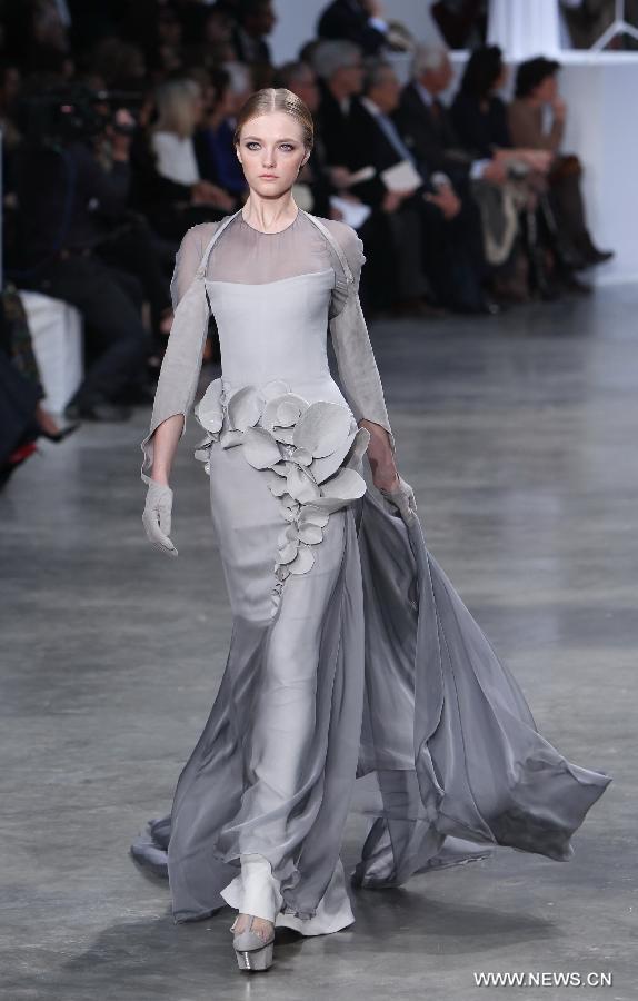 A model presents a creation by French designer Stephane Rolland during the Haute Couture Spring-Summer 2013 collection shows in Paris, France, Jan. 22, 2013. (Xinhua/Gao Jing) 