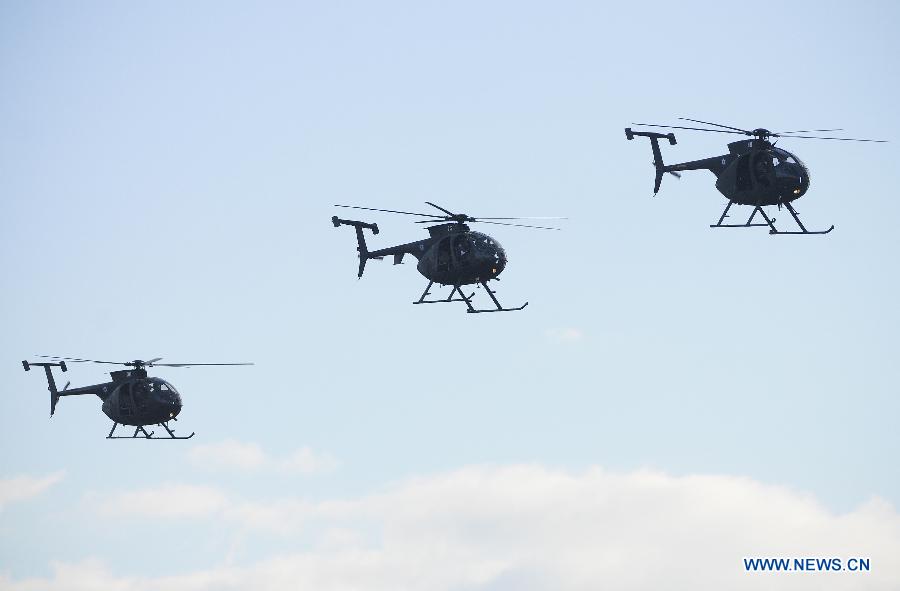 Helicopters MD-500E of Salvador attend the "2013 Ilopango Air Show", at the Ilopango air base in the city of San Salvador, capital of El Salvador, on Jan. 26, 2013. The show was held to raise funds for the National Children's Hospital Benjamin Bloom. (Xinhua/Oscar Rivera) 