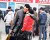 Beijing Railway Station saw many drawn-out farewells on Sunday as travel rush begins. 