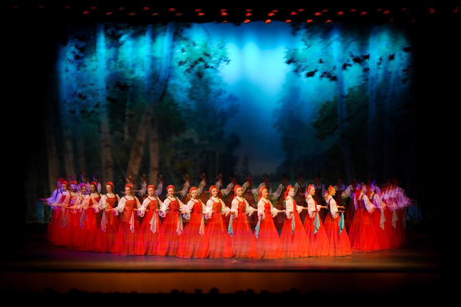 Artists of the National Little Birch Tree Dance Troupe of Russia perform at the Oriental Theatre in Changchun, capital of northeast China's Jilin Province, Jan. 28, 2013. The performance was staged to greet the upcoming Spring Festival which falls on Feb. 10 this year. (Xinhua/Xu Chang)