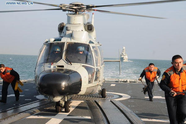 A Chinese People's Liberation Army (PLA) Navy fleet has set off from a military port in east China's Qingdao City for regular open-sea training in the West Pacific Ocean, military sources revealed Wednesday. (Xinhua/Li Yun) 