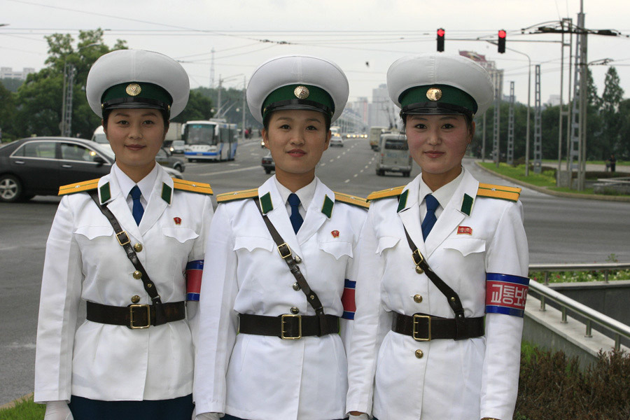 There may not be so many skyscrapers and modern automobiles on the streets in Pyongyang; however,there is one unique view in Pyongyang - the female traffic police officers. There are quite strict requirements to meet to be female traffic police officers in Pyongyang, for example, one's height must be over 163 centimeters. Every year 20 versatile candidates will be chosen from 16-year-old students. The government-paid makeups provided for them are from the best brands in Pyongyang. They must quit their job when they turn 26.(file photo)