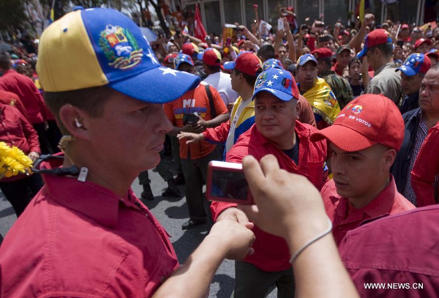 President of the Venezuelan National Assembly Diosdado Cabello (C Fronr) participates in the funeral procession in honor of Venezuelan President Hugo Chavez on the streets of Caracas, capital of Venezuela, on March 6, 2013. On Tuesday afternoon, Venezuelan President, Hugo Chavez, died after fighting for almost two years with a cancer disease. The body of Chavez is moved from the health center to the Military Academy in southern Caracas, inside Tiuna's Fort. (Xinhua/David de la Paz)