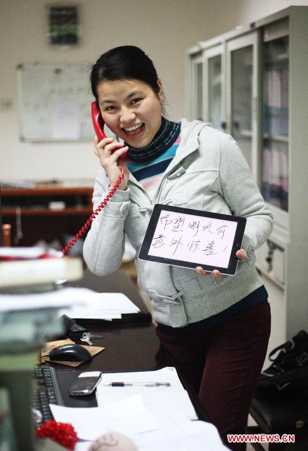 31-year-old Ms. Li, a college teacher having a loving family, wishes for a suprise from her husband for the Women's Day in Nanchang, capital of east China's Jiangxi Province, March 7, 2013. (Xinhua) 