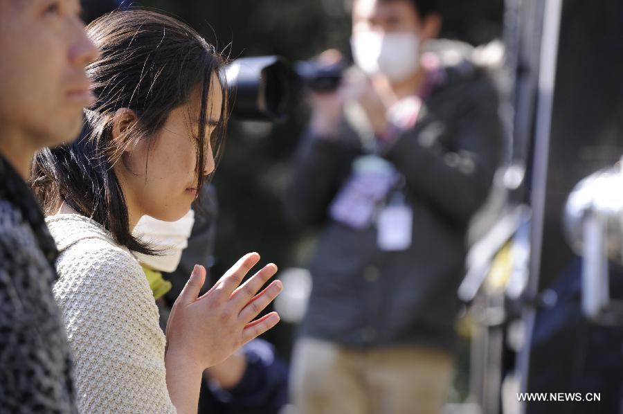  People attend a mourning ceremony in Tokyo, capital of Japan, on March 11, 2013. A mourning ceremony was held here Monday to mark the two year anniversary of the March 11 earthquke and ensuing tsunami that left more than 19,000 people dead or missing and triggered a nuclear accident the world had never seen since 1986. (Xinhua/Kenichiro Seki) 