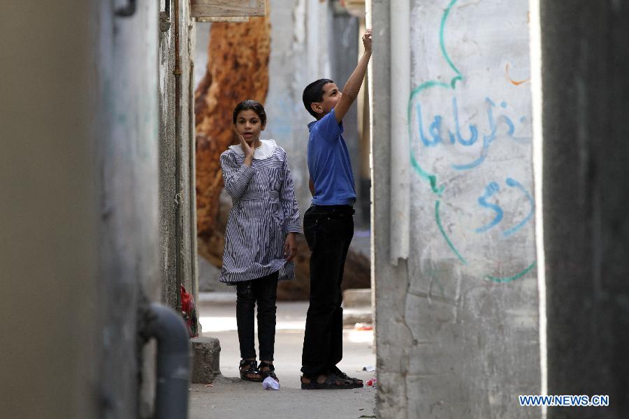 Palestinian children play in the al-Shati refugee camp in Gaza City on March 13, 2013. About 700,000 Palestinians left their homes and settled in refugee camps in the Gaza Strip, the West Bank and neighboring Arab countries. (Xinhua/Yasser Qudih) 