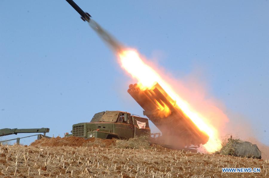 The undated photo provided by Korean Central News Agency (KCNA) on March 14, 2013 shows a live ammunition drill of the Democratic People's Republic of Korea (DPRK) at the southwest sector of the front line. DPRK's top leader Kim Jong Un watched and guided the drill which was conducted by the Jangjae Islet defense detachment and the Mu Islet artillery detachment. (Xinhua/KCNA)  