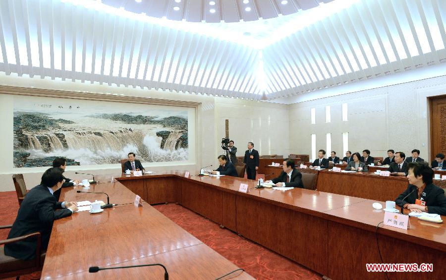 Executive chairpersons of the presidium of the first session of the 12th National People's Congress (NPC) hold their sixth meeting at the Great Hall of the People in Beijing, capital of China, March 16, 2013. Zhang Dejiang, executive chairperson of the presidium, presided over the meeting here on Saturday. (Xinhua/Ma Zhancheng)  