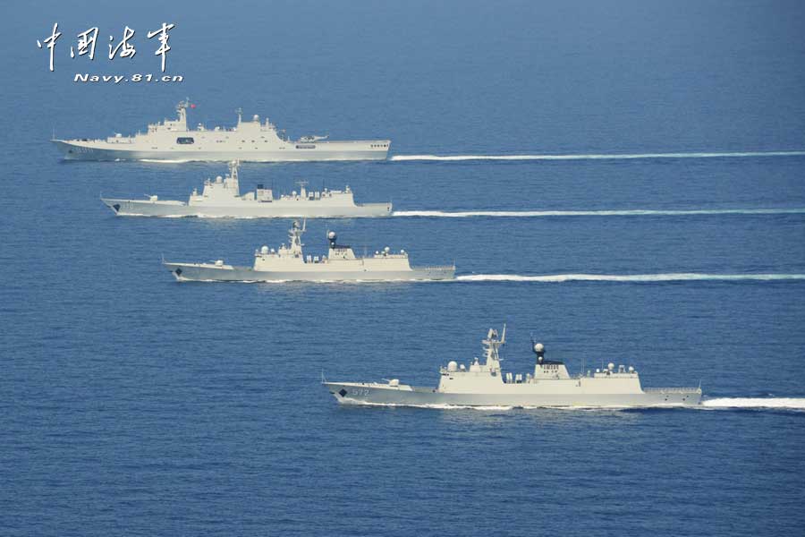 The picture shows the "Jinggangshan" amphibious dock landing ship, the "Lanzhou" guided missile destroyer, the "Yulin" guided missile frigate and the "Hengshui" guided missile frigate of the combat-readiness patrol and high-sea training taskforce under the South China Sea Fleet of the Navy of the Chinese People's Liberation Army (PLA) conducts training on the subject of battle-order deploying in the waters of the South China Sea on March 22, 2013. (PLA Daily/Qian Xiaohu Gao Yi and Gan Jun)