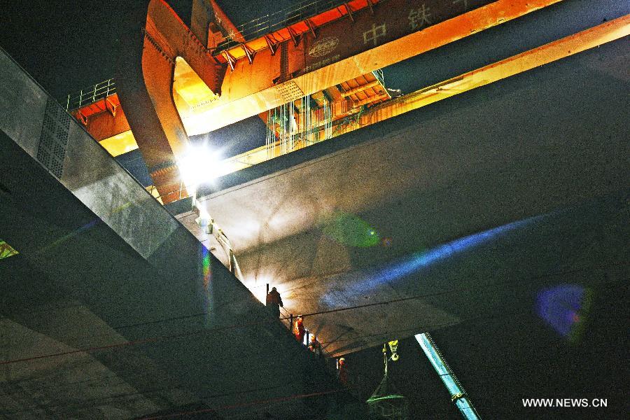 Photo taken on March 21, 2013 shows the construction site of the Yiwu section of the Hangzhou-Changsha High-speed Rail on the Dongte Bridge in Yiwu, east China's Zhejiang Province. The 920-kilometer-long Hangzhou-Changsha High-speed Rail would shorten the travelling time between east China's Hangzhou and central China's Changsha from 6.3 hours to 3 hours once completed. (Xinhua/Cui Xinyu)