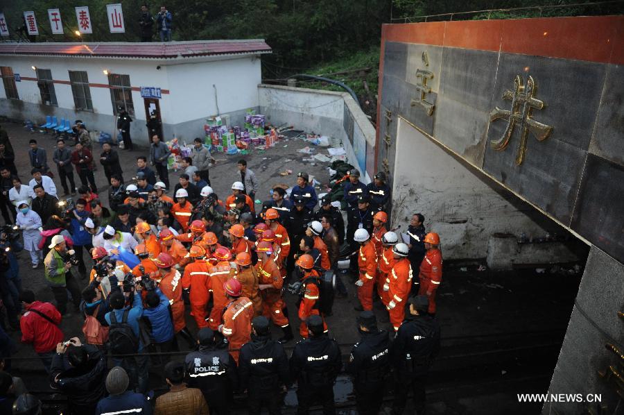 A rescued miner is carried out of the mine shaft of a flooded coal mine in Weng'an County, southwest China's Guizhou Province, April 8, 2013. Three miners trapped in the flooded Yunda Coal Mine for about 60 hours were rescued early Monday morning. Three others remained missing at the mine, which was hit by flood last Friday. Rescuers had earlier confirmed that three miners had been dead. (Xinhua/Liu Xu)