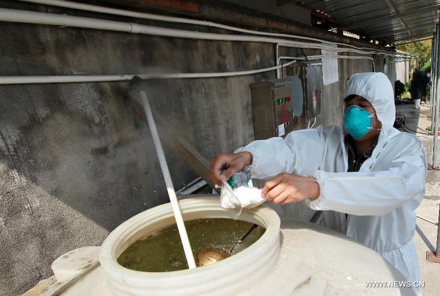 A worker puts disinfectant into flushing water at the center for harmless treatment of animals in Shanghai, east China, April 10, 2013. As the only place where provides with harmless treatment of animals in Shanghai, the center works around the clock and handles about 40 tons of poultry died from culling operations daily. As of Tuesday afternoon, China had reported a total of 28 H7N9 cases in Shanghai municipality and the provinces of Jiangsu, Anhui and Zhejiang, including nine fatalities. (Xinhua/Pei Xin) 