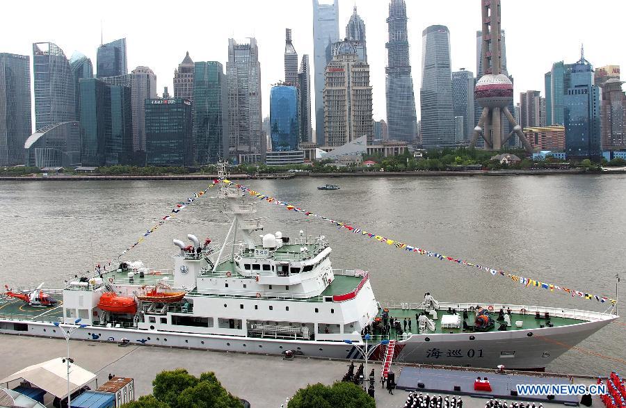 Patrol vessel Haixun 01 is berthed at a port in Shanghai, east China, April 16, 2013. Haixun 01, officially delivered and put into service Tuesday and managed by the Shanghai Maritime Bureau, is China's largest and most advanced patrol vessel. The 5,418-tonnage Haixun01 is 128.6 meters in length and has a maximum sailing distance of 10,000 nautical miles (18,520 km) without refueling. It will carry out missions regarding maritime inspection, safety monitoring, rescue and oil spill detection and handling. (Xinhua/Chen Fei) 