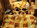 Red Cross members have a rest in a temporary tent 