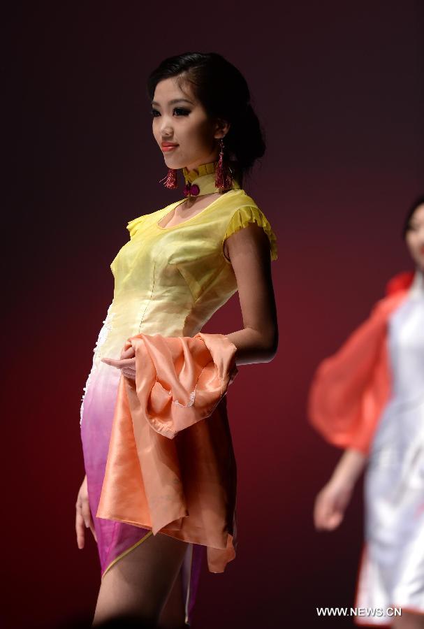 A model presents fashion creation designed by Gao Lixin during the 2013 China (Qingdao) International Fashion Week in Qingdao, a coastal city in east China's Shandong Province, May 5, 2013. (Xinhua/Li Ziheng) 