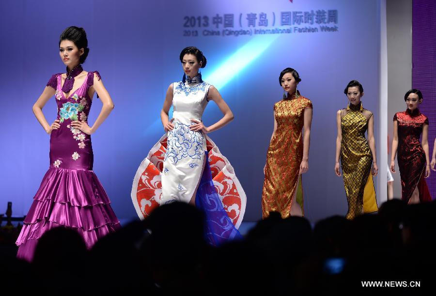 Models present fashion creations designed by Gao Lixin during the 2013 China (Qingdao) International Fashion Week in Qingdao, a coastal city in east China's Shandong Province, May 5, 2013. (Xinhua/Li Ziheng) 