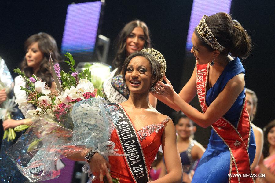 Tara Teng (R), Miss World Canada 2012, crowns Camille Munro of Regina, Saskatchewan, who won the title of Miss World Canada 2013 on May 9, 2013 in Richmond, BC, Canada. She will represent Canada at Miss World 2013 in Jakarta, Indonesia, in September. (Xinhua/Sergei Bachlakov)