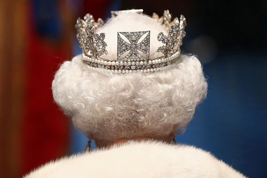 Queen Elizabeth II unveils the coalition government's legislative programme in a speech delivered to Members of Parliament and Peers in The House of Lords. Proposed legislation is expected to be introduced on toughening immigration regulations, capping social care costs in England and setting a single state pension rate of 144 GBP per week. (Xinhua/AFP Photo)