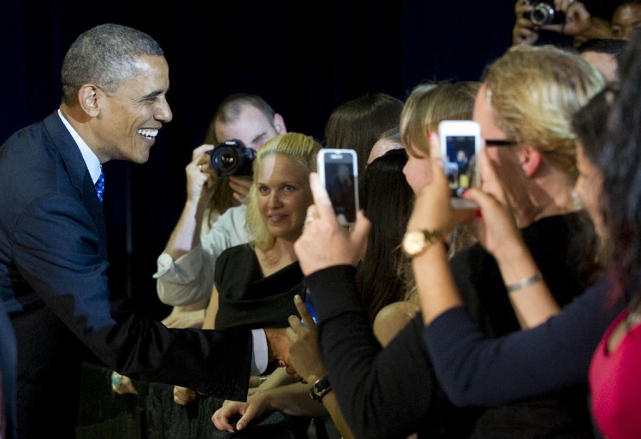 U.S. President Barack Obama greets students during a visit to Manor New Technology High School in Austin, Texas May 9, 2013. Obama flew to Texas on Thursday to put his focus back on job creation and economic growth after concentrating on gun control legislation and immigration reform in recent months. (Xinhua/AFP Photo)