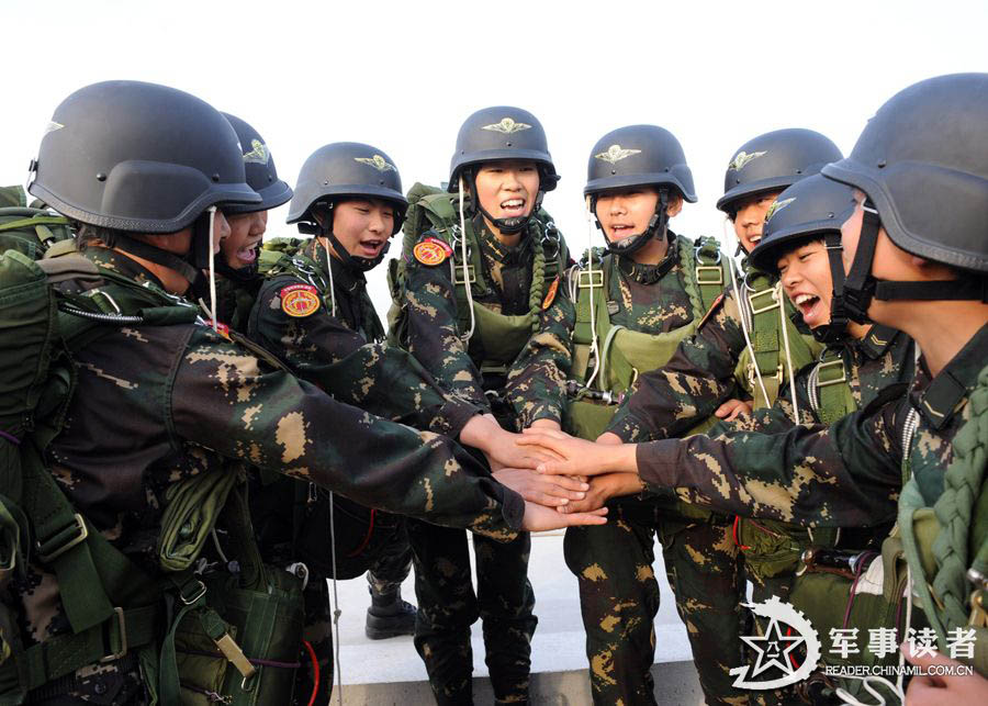 The members from the first female special operation company of the Army of the Chinese People's Liberation Army (PLAA) are in their first parachute landing training on May 14, 2013. (China Military Online/Cheng Jianfeng, Yan Xingxing)