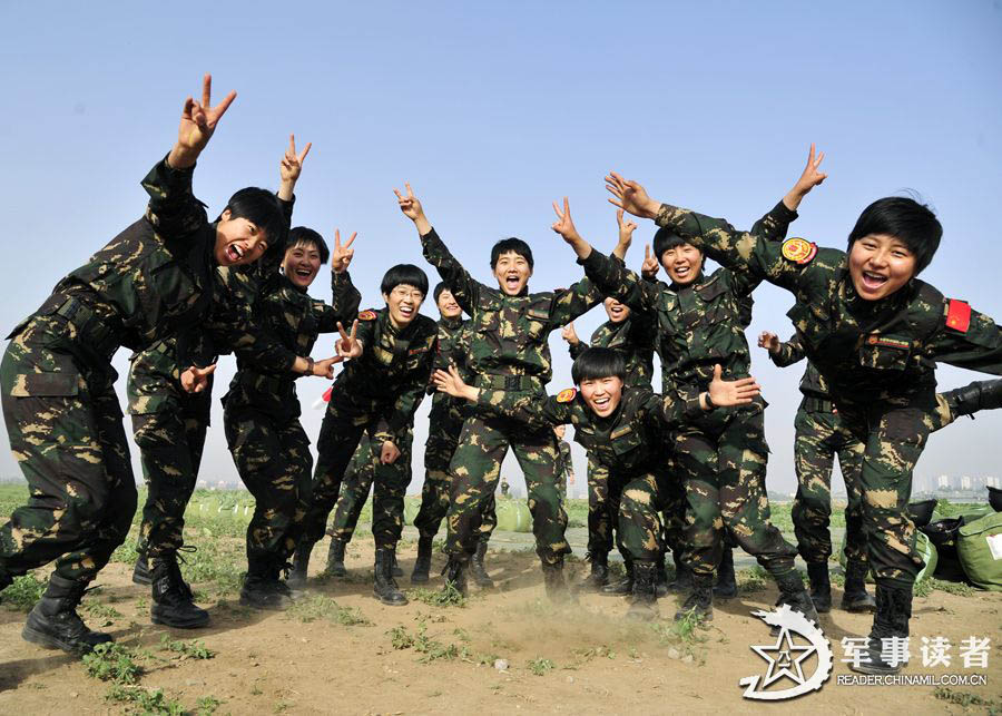 The members from the first female special operation company of the Army of the Chinese People's Liberation Army (PLAA) are in their first parachute landing training on May 14, 2013. (China Military Online/Cheng Jianfeng, Yan Xingxing)