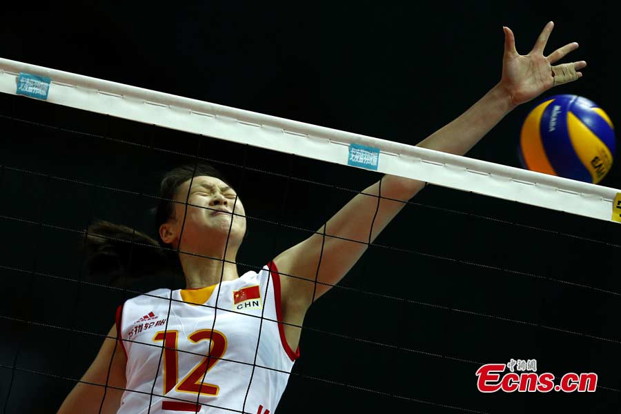 Chinese volleyball players are in a match against Puerto Rico in Ningbo, Zhejiang Province, May 19, 2013. The Chinese team, which was formed last week, proved a class above their opponents and won the match 25-12, 25-20, 25-14 in just one hour and 11 minutes at the Beilun International Volleyball Tournament. (CNS/Fu Tian)