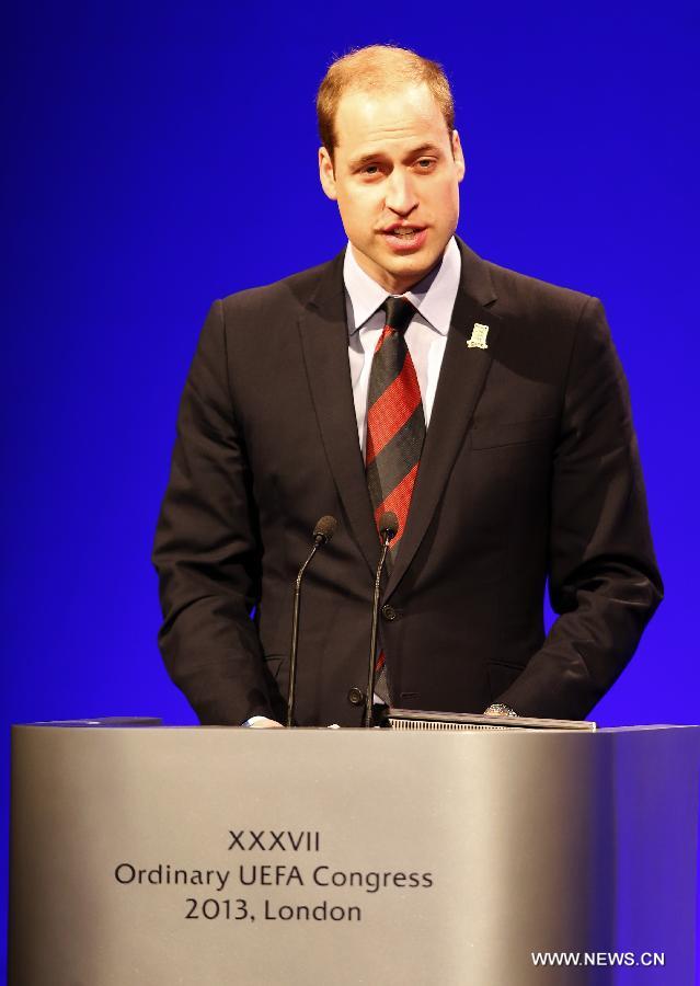 Prince William, the Duke of Cambridge, addresses the XXXVII Ordinary UEFA Congress 2013 at Grovesnor House Hotel in London, Britain, on May 24, 2013. (Xinhua/Wang Lili)   