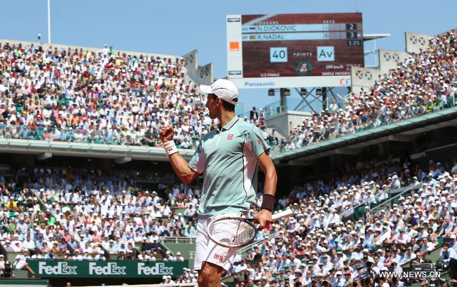 Novak Djokovic of Serbia reacts during the men's singles semi-final match against Rafael Nadal of Spain at the French Open tennis tournament in Paris June 7, 2013. (Xinhua/Gao Jing)