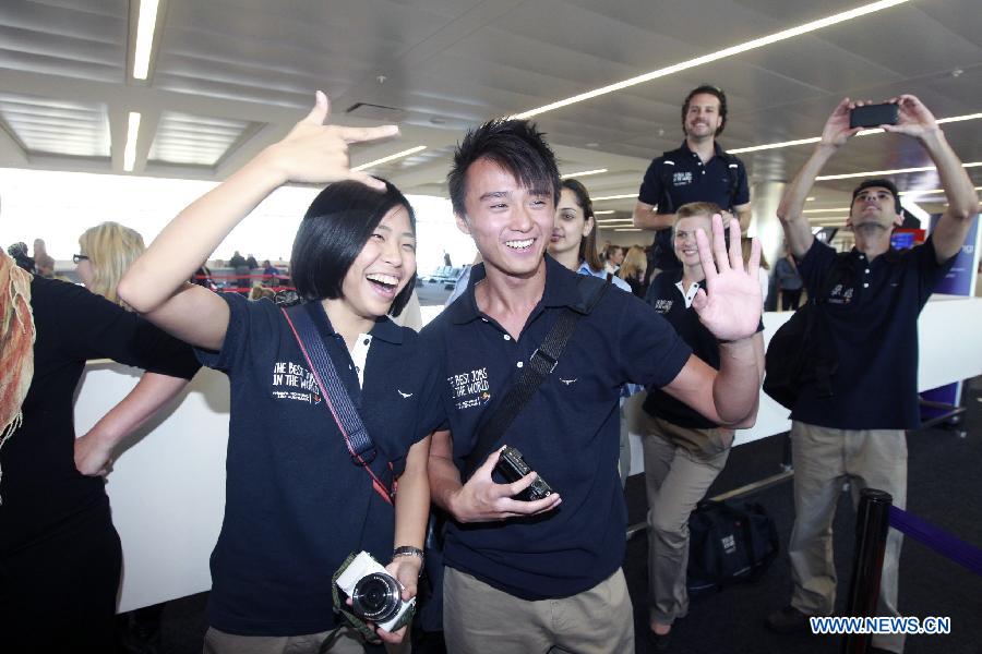 Finalists Hsin Hsuan Hsieh (L, front) from China's Taiwan and Chris Leung from China's Hong kong arrive at the airport in Sydney, Australia, June 13, 2013. A total of 18 finalists arrived in Sydney Thursday, competing for the Best Jobs in the World including the Chief Funster in New South Wales, Lifestyle Photographer in Melbourne, Outback Adventurer in Northern Territory, Park Ranger in Queensland, Taste Master in Western Australia, and Wildlife Caretaker in South Australia. (Xinhua/Jin Linpeng) 